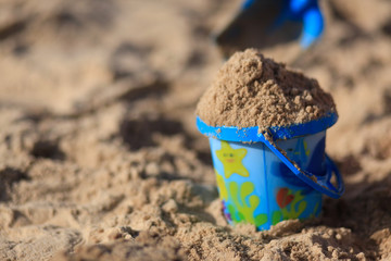 toys on the sandy beach by the sea.