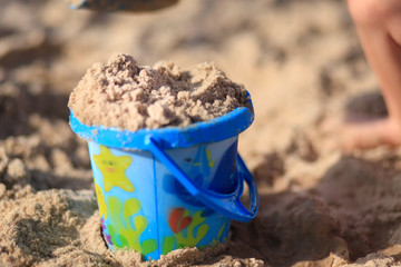 toys on the sandy beach by the sea.