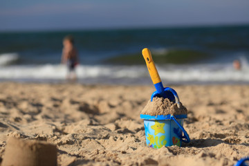 toys on the sandy beach by the sea.