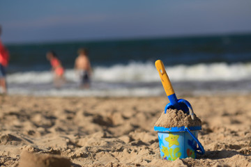 toys on the sandy beach by the sea.