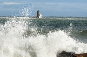 Unique High Tide Causes Large Waves Breaking Around Shore Near Maine Lighthouse