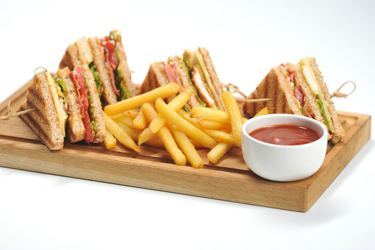 Mediabakery - Photo by Radius Images - Seasoned French Fries in Paper Bag  with Wooden Fork and Ketchup Studio Shot