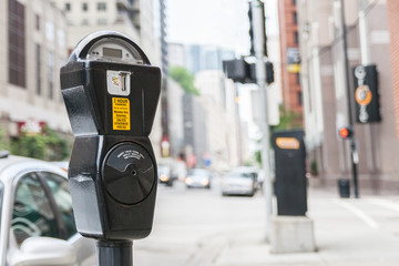 Close-up of a generic american parking meter in the streets of downtown chicago with large copy...