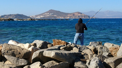 Fototapeta na wymiar Lone Fisherman - Naxos, Greece