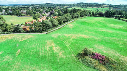 Aerial image over Quarriers village and surrounding countryside in West Central Scotland.