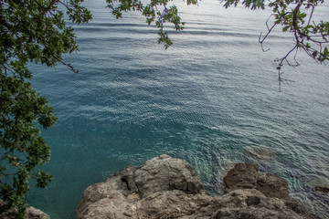 rest calm silence cozy concept of sea waterfront sharpening district with stones and small waves from above