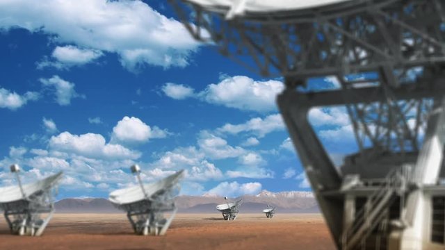 Camera Moving To Reveal Several Radio Telescopes. Beautiful Clouds Move Across Horizon. Advanced Technology Telecommunication System.