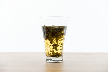 Cold Brew White Tea and Leaves in Glass