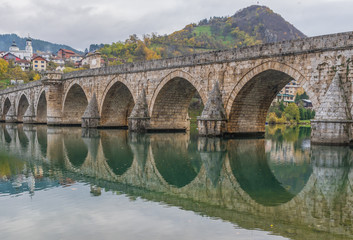 Fototapeta premium Visegrad, Bosnia & Herzegovina - the Mehmed Paša Sokolovic Bridge is one of the main landmarks in the country, and Visegrad one of the pearls of the Balkans
