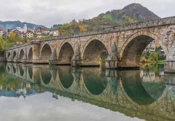 Fototapeta premium Visegrad, Bosnia & Herzegovina - the Mehmed Paša Sokolovic Bridge is one of the main landmarks in the country, and Visegrad one of the pearls of the Balkans