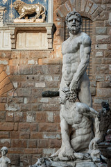 Fototapeta na wymiar Hercules and Cacus by Baccio Bandinelli, Piazza della Signoria, Florence. Palazzo Vecchio facade in the background.