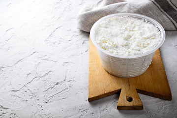 Ricotta cheese on plaster background
