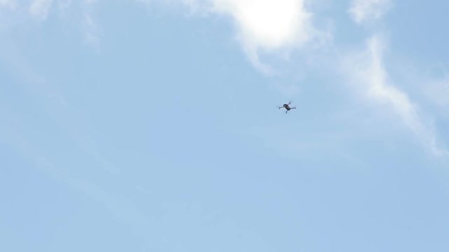 Aerial photography of video from the height, Quadrocopter in the sky