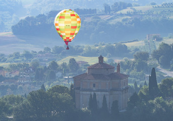 Todi (Umbria, Italy) - The suggestive medieval town of Umbria region, in a summer sunday morning, during the hot air balloons contest "Sagrantino Cup 2018"