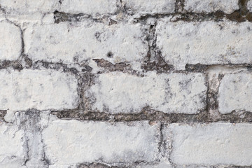 An old painted white brick wall