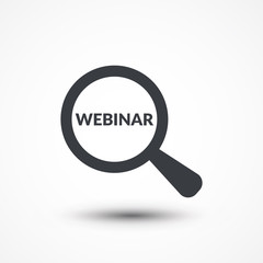 Magnifying glass with word webinar on white background
