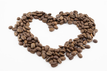  Coffee beans on a white background in the form of a heart isolated