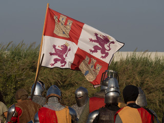 Spanish medieval knights with spanish royal flag
