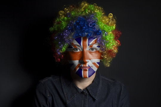 Funny clown woman with painted british flag
