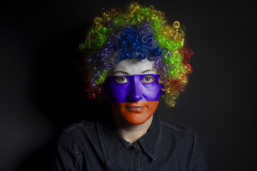 Funny clown woman with painted Russian flag