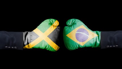Male hand in Boxing gloves with Jamaica and Brazil flags. Jamaica versus Brazil concept.