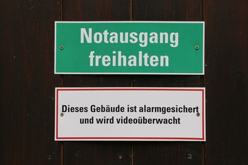 German Signs: alarm-protected building, Keep emergency exit clear and video surveillance, Schilder...