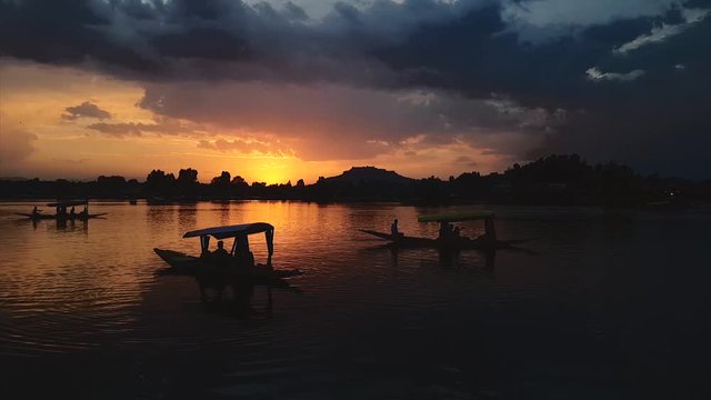 People enjoying the Boat Rides a.k.a Shikara in the Beautiful City of Srinagar during Sunset - I