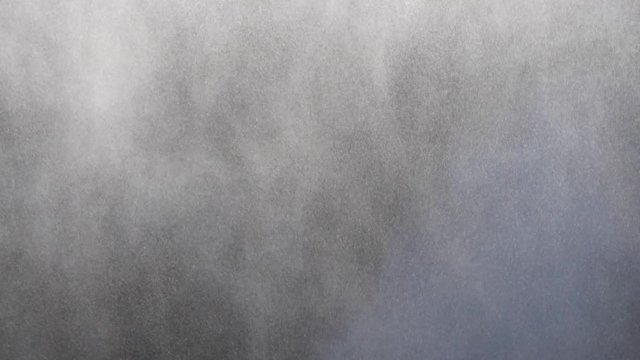 Slow Motion Heavy Mist Spraying Up From Waterfall In Rocky Canyon