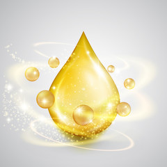 Falling drop of golden oil with shiny winds. Precious liquid skin care emulsion, symbol of organic nutrition, natural make up components, healthy cooking, ecological production, isolated on white.