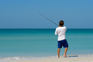 Young Man Fishing © EyeMark