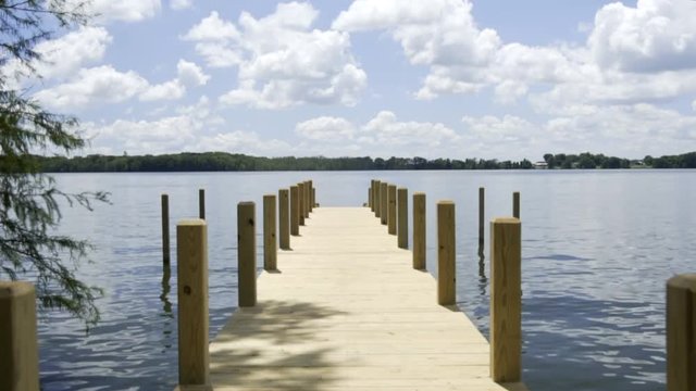 Peaceful Lake Dock with Summertime Clouds