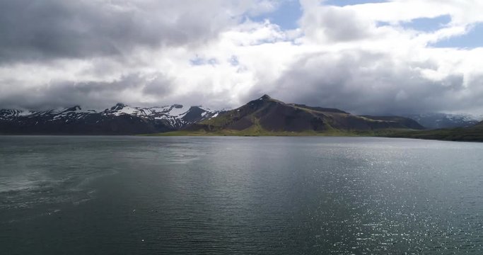 beautiful mountain scenery with lake in iceland seen by drone