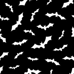 Set of bats silhouettes flying isolated on black background