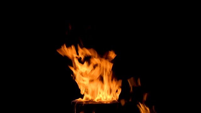 Small flame explodes into big flame. 4k