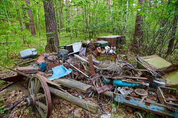 Dump old metal objects in the woods, rusty scrap metal.  Environ