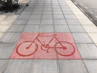 Bicycle road sign on street background texture