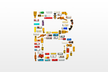 English letters formed by arrangement of Car toy diecast on the white background , Top view