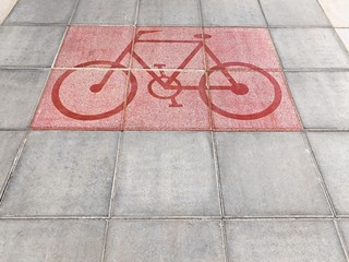 Bicycle road sign on street background texture