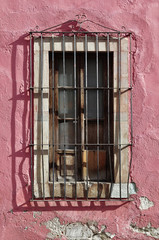 Mexican colonial style window with metal bars in Guanajuato Mexico
