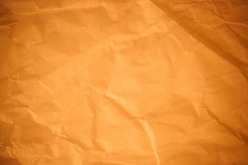 Brown crumpled paper background.