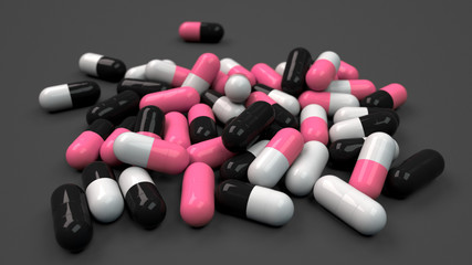 Pile of black, white and red medicine capsules