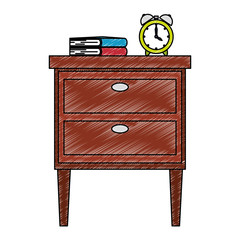 wooden drawer with books and alarm