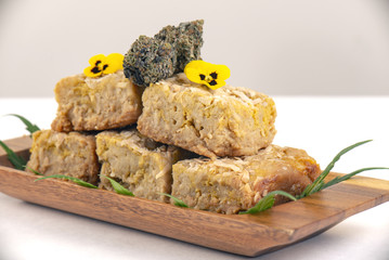 Cannabis infused blondies isolated on white background