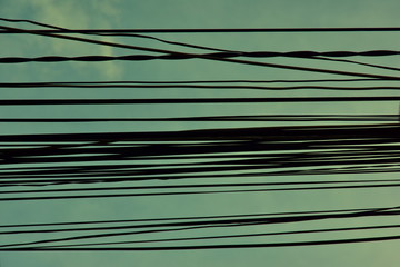 View from the window on the wires and cable against the sky in the poor neighborhood of Nha Trang. Vietnam