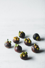 Natural Mangosteen On white wood