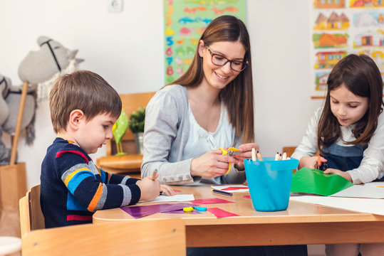 Preschool Teacher with Children at Kindergarten - Creative Art Class