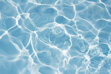 Texture of water in swimming pool for background