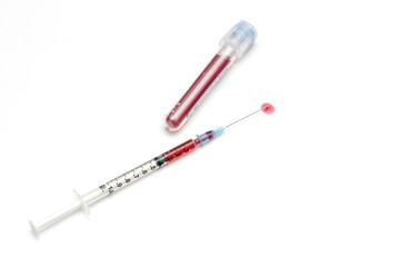 Fototapeta premium the 'BLOOD' concept of blood samples in the test tube, the droplets of the injection tip end