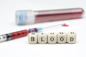 the 'BLOOD' concept of blood samples in the test tube, the droplets of the injection tip end