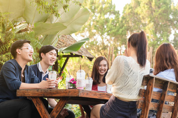Group of friends hang out in cafe have fun together